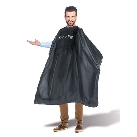 Andis black barber cape with logo, side view on model