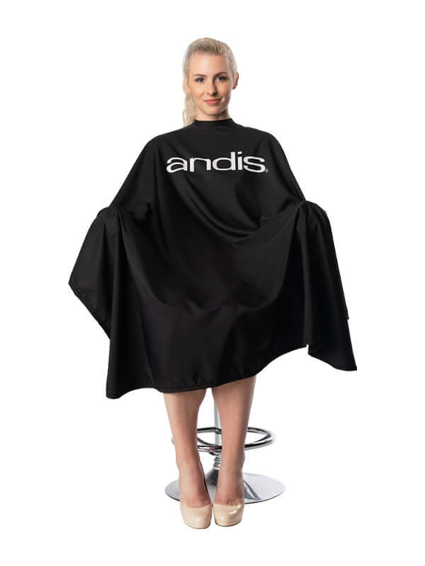Andis black barber cape with logo, worn by female model